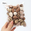 A clear plastic bag filled with 50 reusable expandable makeup sponges in various natural and beige tones.