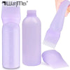 A purple bottle of hair color applicator contains a fine-tooth comb and a plastic applicator brush.