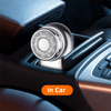Close-up of a silver electric beard trimmer shaver inserted into a car's interior console.