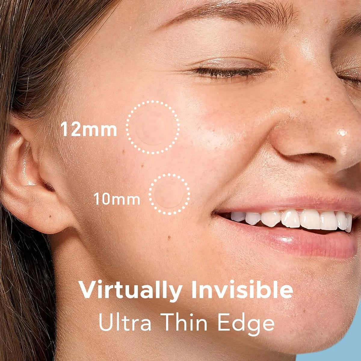 Close-up of a woman's face showing ultra thin edge acne spot patches applied on the skin.