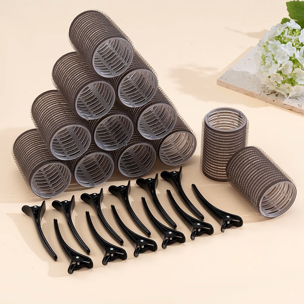 A set of metallic hair rollers for heatless curls and volume, shown in various sizes and angles.