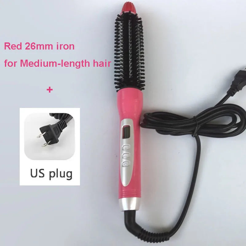 A pink hair straightener with a red 26mm iron and black cord, shown next to a US plug.