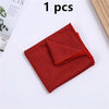A single red microfiber sport towel folded neatly on a white surface.