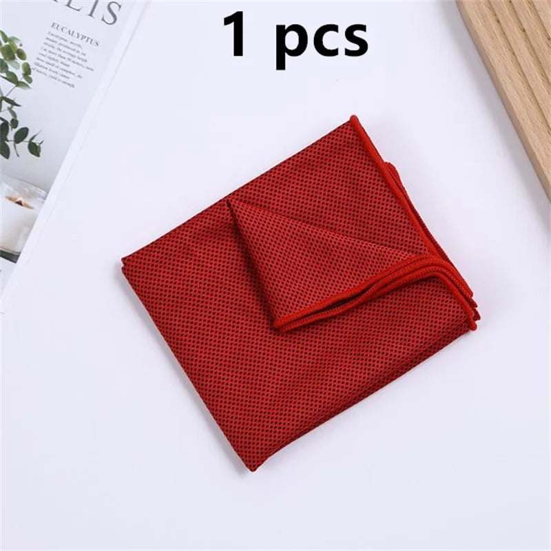 A single red microfiber sport towel folded neatly on a white surface.