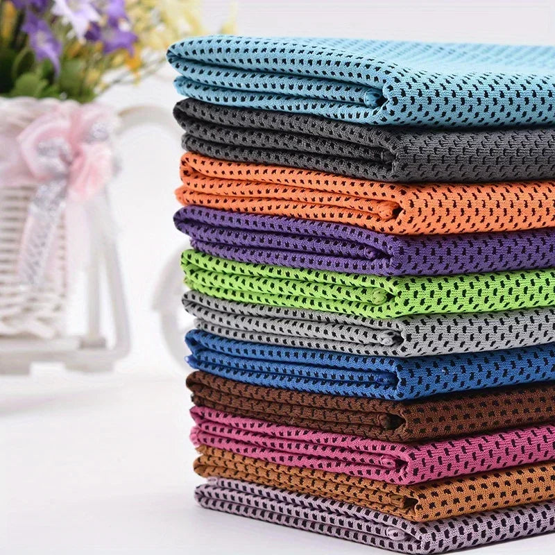 A stack of colorful ultra soft quick-dry sport towels in various shades of blue, purple, orange, and green.