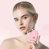 A woman is shown using a pink microcurrent facial lifting roller massager on her cheek.