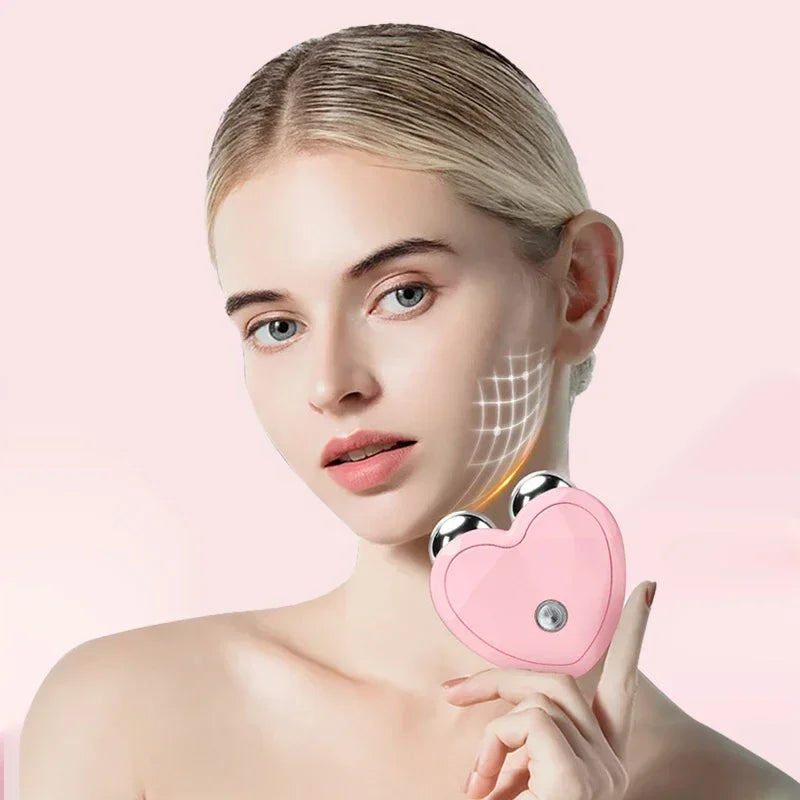 A woman is shown using a pink microcurrent facial lifting roller massager on her cheek.