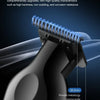 A close-up of a black powder metallurgical blade moving knife attached to a professional electric grooming device.