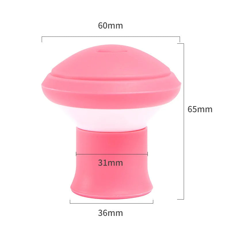 Pink facial toner jaw exerciser with a dome top and base.