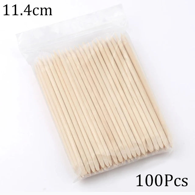 A package containing 100 natural wood nail art pusher sticks, measuring 11.4cm long.