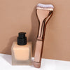A professional foundation brush with soft nylon bristles displayed against a neutral background.