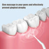 A white oral irrigator tip is shown massaging gums on a pink gum tissue.