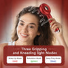 A woman is using a red electric scalp massage comb with three gripping and kneading light modes for hair care.