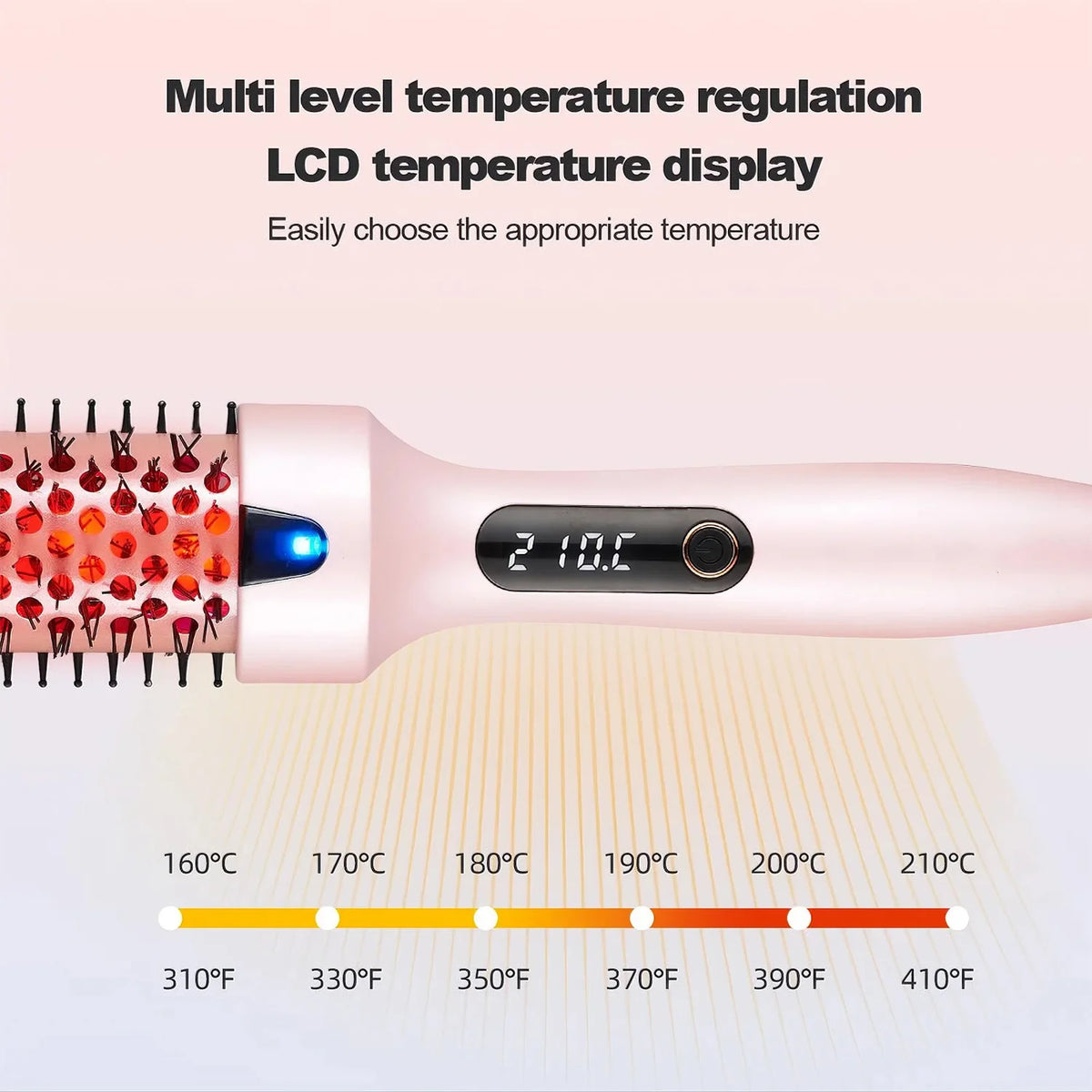 A pink heated round hair brush displaying a temperature of 210°C with a scale showing various temperatures.