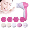 Cepillo facial eléctrico rosa con múltiples accesorios de silicona para el cuidado de la piel.