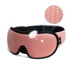 A pink 3D sleeping eye mask with a black trim and a circular insert is shown.