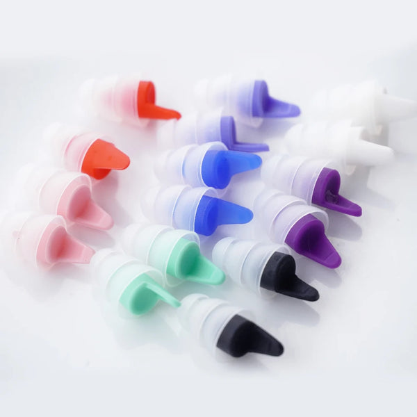 A collection of silicone earplugs in various colors including red, purple, blue, pink, green, and black.