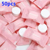 A pile of pink disposable wet wipes for sensitive skin packaged in individual plastic wrappers.