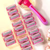 A pink precision safety razor with six layers of stainless steel blades is shown next to its packaging.