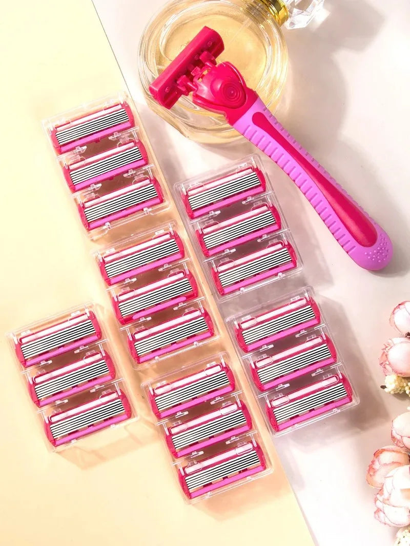 A pink precision safety razor with six layers of stainless steel blades is shown next to its packaging.