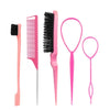 A set of pink hair styling tools including a comb, brush, and pick