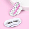 A white replacement shaving blade set with three pink-tipped blades is shown on a pink background.