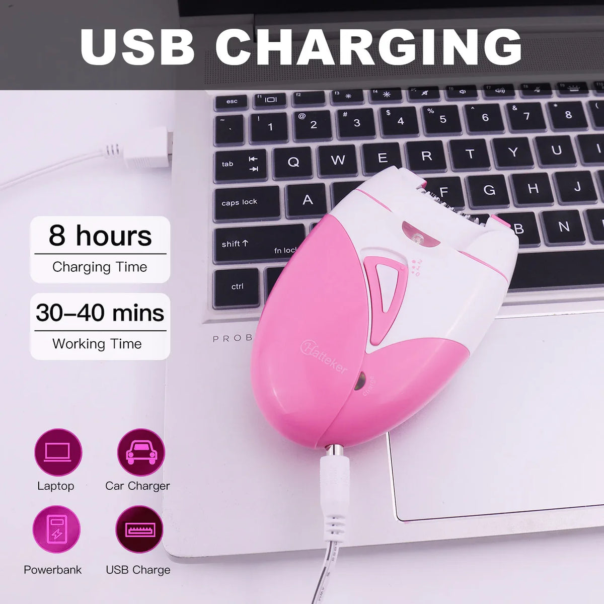 A pink electric hair removal epilator device plugged into a laptop USB port for charging.
