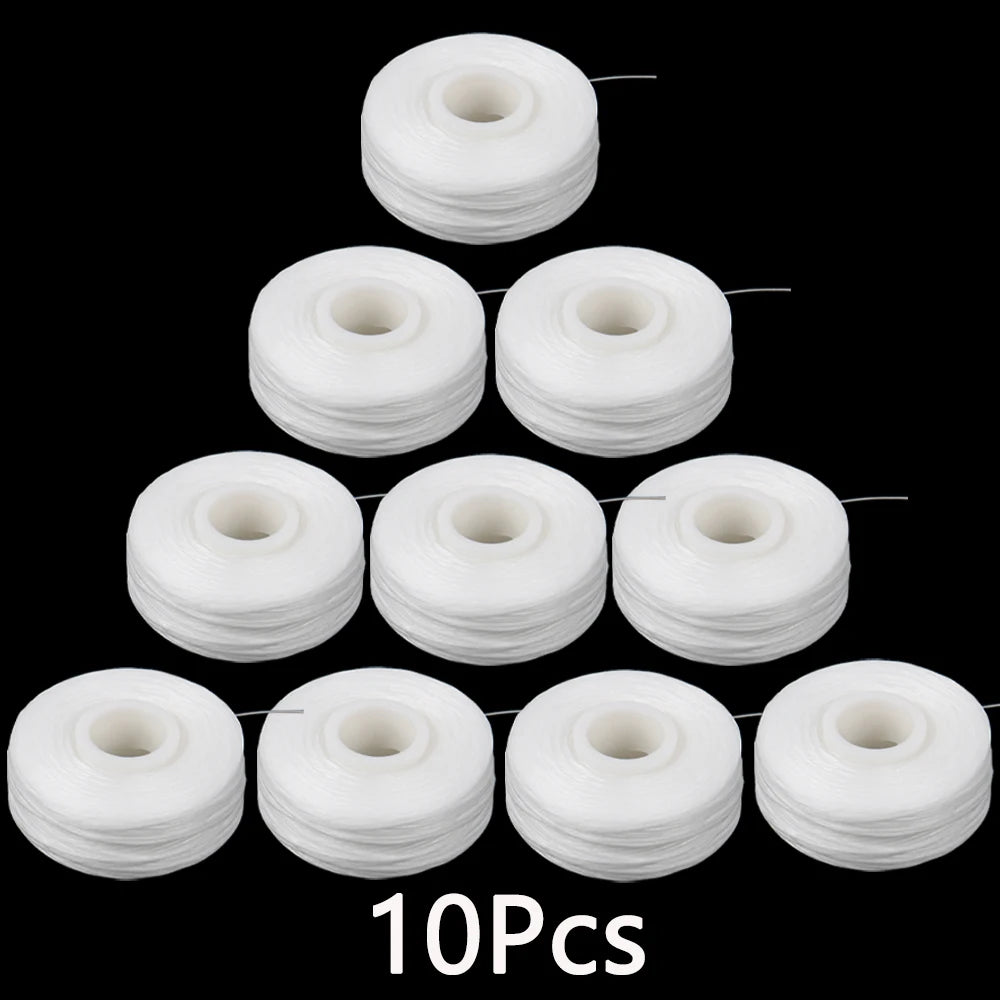 Ten white dental floss spools arranged in a vertical and horizontal layout against a black background