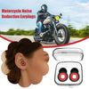 Un couple de bouchons d'oreille anti-bruit pour moto à côté d'une moto et d'une boîte ouverte.