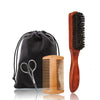 A set of a wooden boar bristle beard brush and comb with a black fabric gift bag