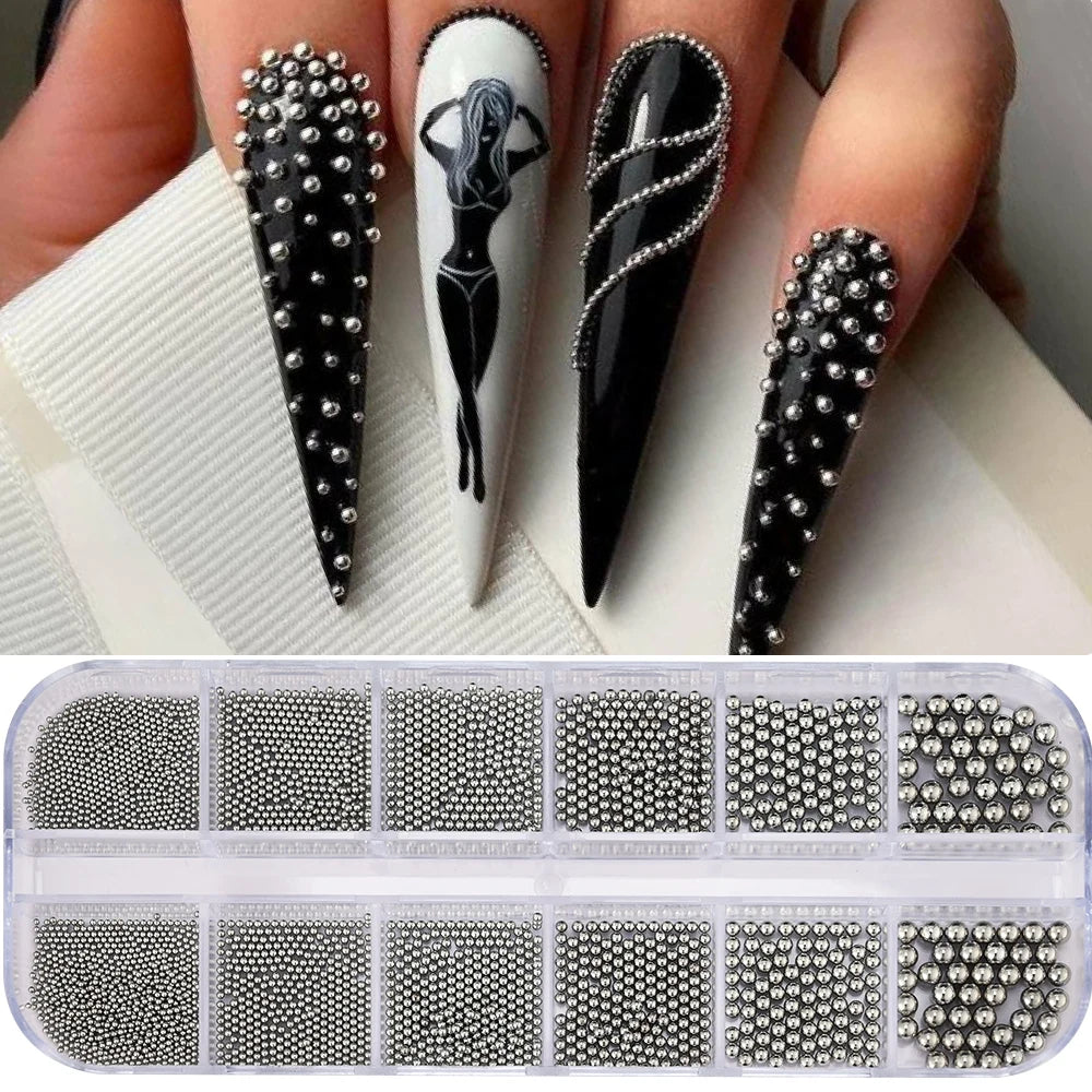 A collection of gold mixed stainless steel bead nail art decorations in various sizes and finishes.