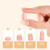 A hand is shown inserting a pink memory foam earplug into an ear, demonstrating the product for noise reduction.