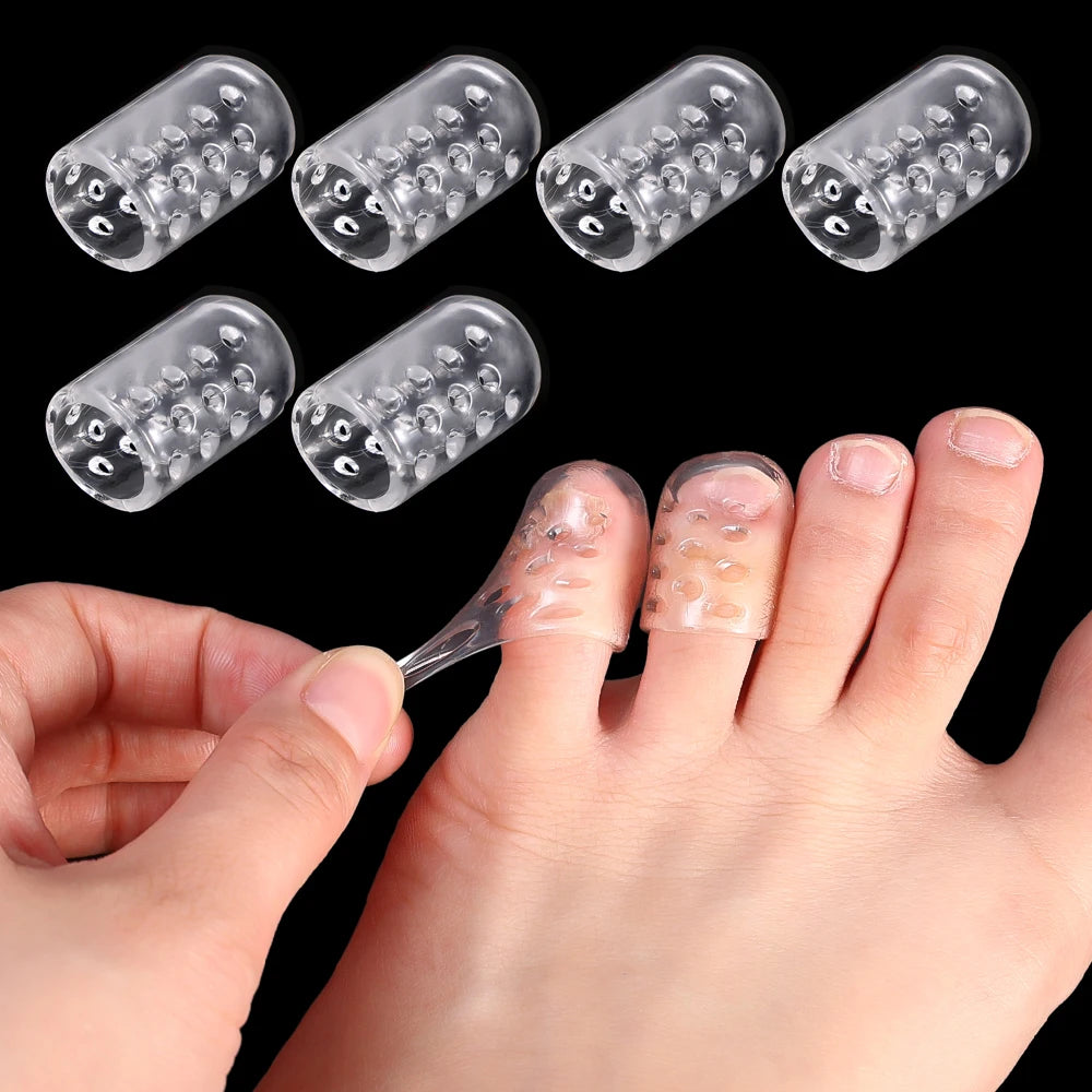 Clear silicone toe covers being placed on a person's foot for protection