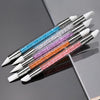 A set of pink nail art liner brush pens with ultra-fine tips arranged diagonally on a gray surface.