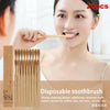 A woman is shown using a set of disposable bamboo toothbrushes for oral hygiene.