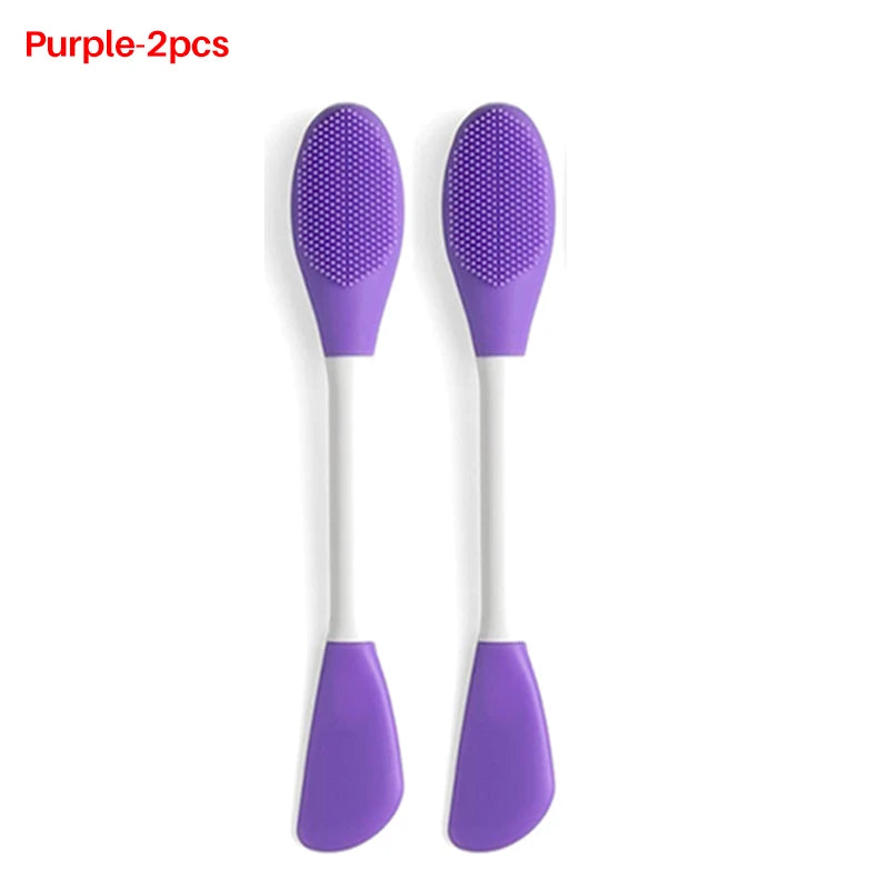 A pair of purple silicone facial brushes for exfoliation