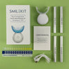 A white box and various components of a Smilekit rechargeable teeth whitening kit are displayed on a green background.
