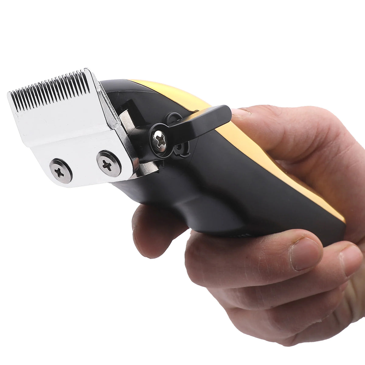 A hand holds a black and gold professional LCD hair clipper set with a silver comb attachment.