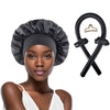 A black satin sleep cap and heatless hair curler set with a claw clip and rings displayed on a model's head.