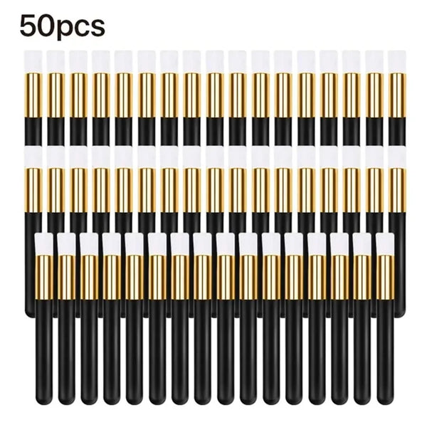 A set of 50 eyelash extension cleaning brushes with black handles and gold nylon bristles.