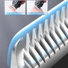 Close-up view of a professional electric hair clipper trimmer showing multiple cutting teeth and safety features.
