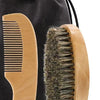 A wooden boar bristle beard brush and comb set with a black fabric gift bag.