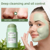 A woman applies a green acne clay mask stick to her face for deep cleansing and oil control.