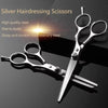 Silver hairdressing scissors set with high quality steel blades shown on a dark surface