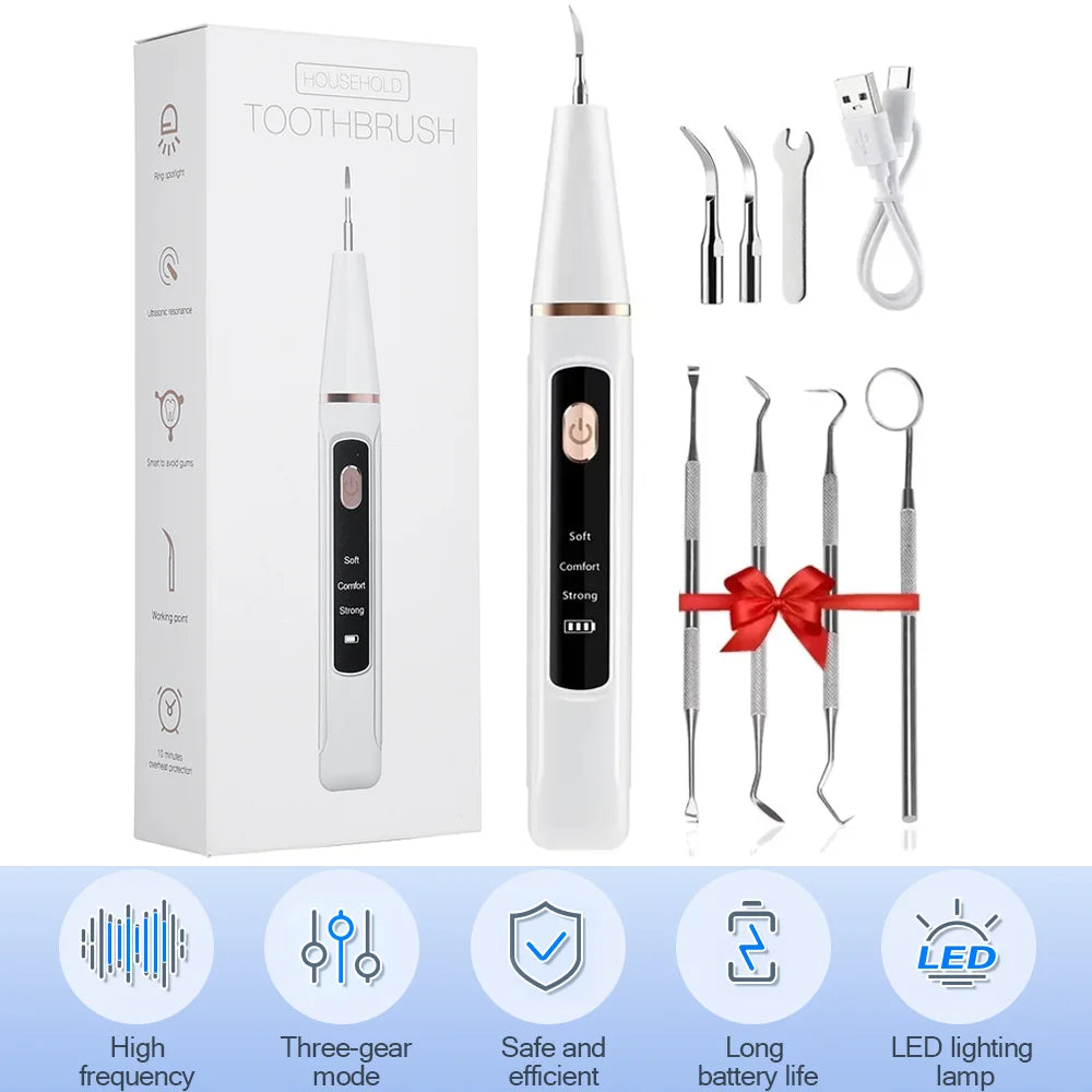 A white household toothbrush set including a handle and multiple cleaning tips for dental scaling