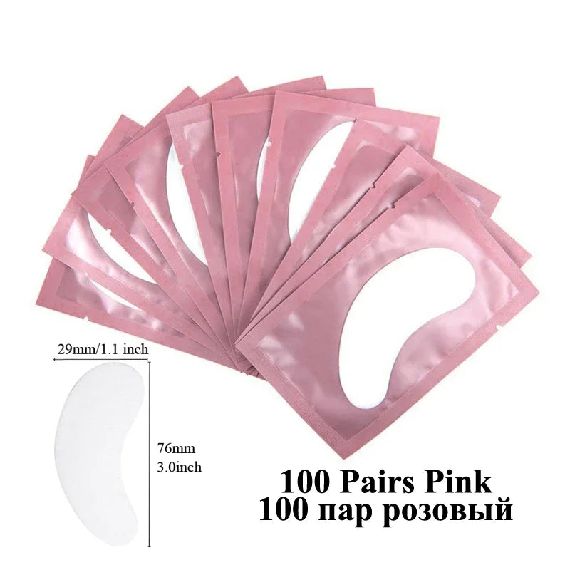 A pack of 100 pairs of pink under-eye lash application patches shown spread out.
