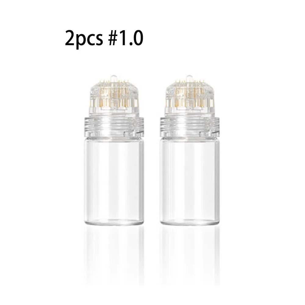 A set of two clear glass microneedling stamps with metal needles inside