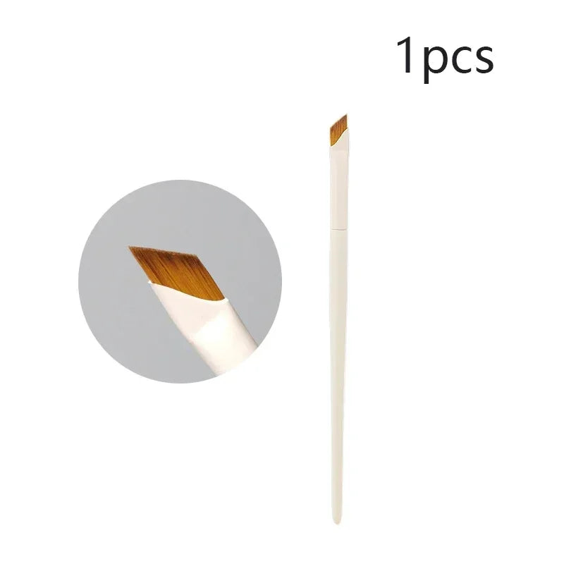 A single precision eyeliner application brush with a wooden ferrule and white handle.