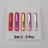 A set of five colorful mini perfume spray bottles in various metallic shades arranged on a white foam pad.