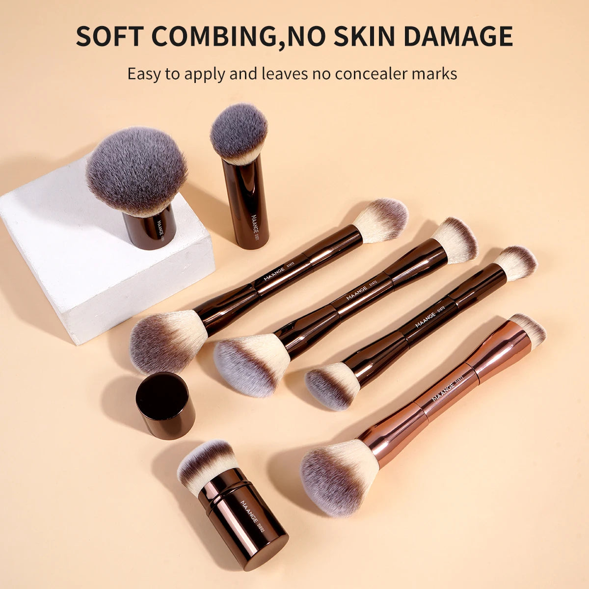 A collection of soft makeup brushes in various shades and sizes displayed on a light background.